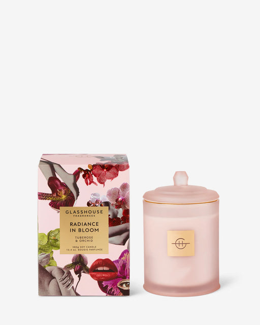 Pink candle with decorative packaging on a white background